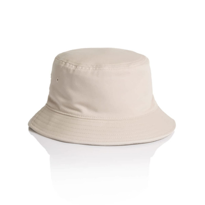 A beige bucket hat with a wide brim and a simple design. It features a label on the side.