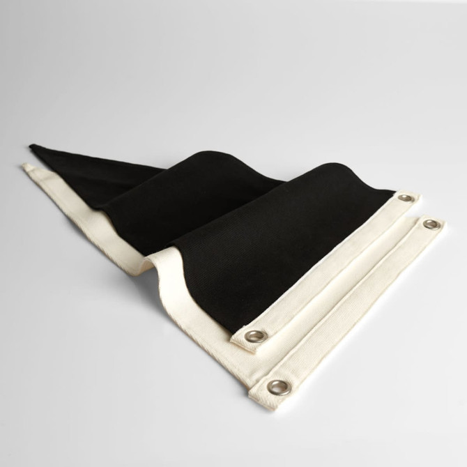 A black and cream canvas pennant flag with grommets for easy hanging, featuring a folded design.