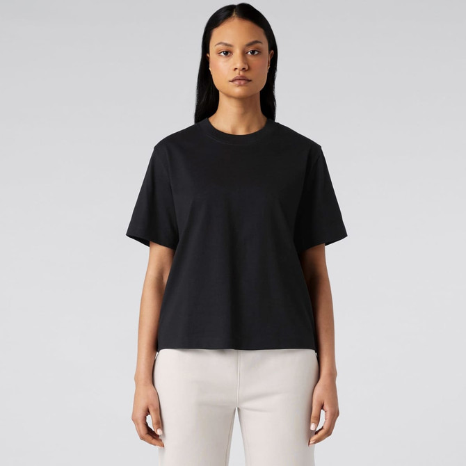 A black T-shirt with short sleeves and a relaxed fit, displayed on a model against a neutral background.