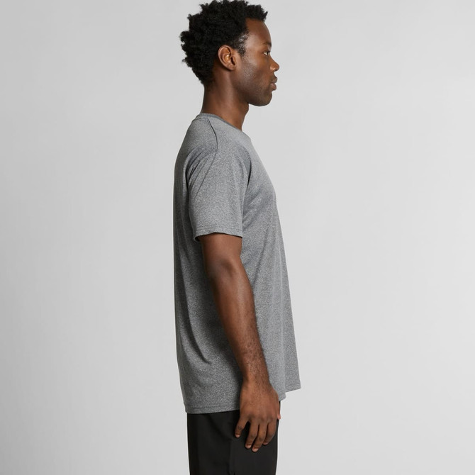 A side view of a grey T-shirt worn by a person, featuring a simple design and a visible logo.