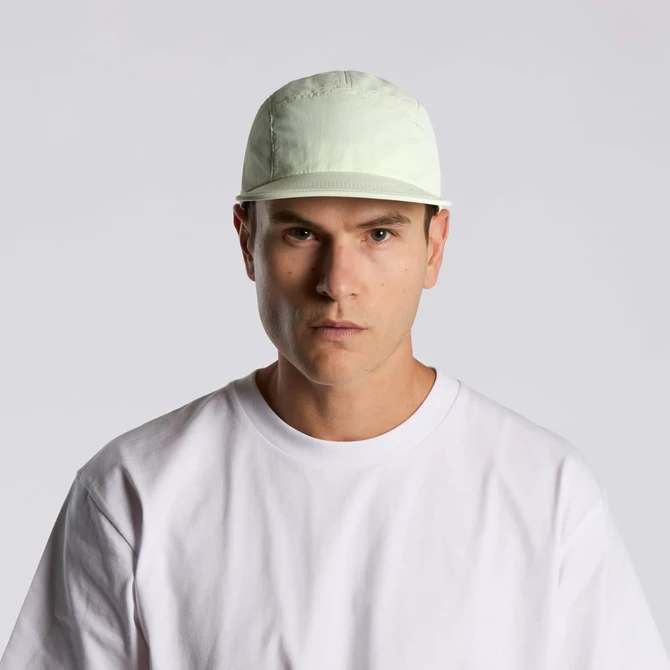 A light green nylon cap features a structured design and has a logo on the front.