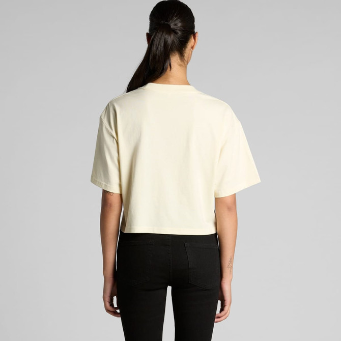 A cropped tee in a light cream colour with a relaxed fit, featuring short sleeves and a simple design.