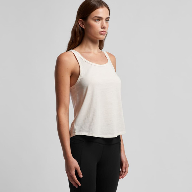 A light beige racerback singlet with a relaxed fit, featuring a logo on the side.