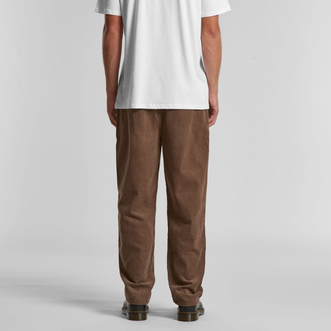 Brown corduroy pants with a loose fit, displayed from the back, paired with a plain white t-shirt.