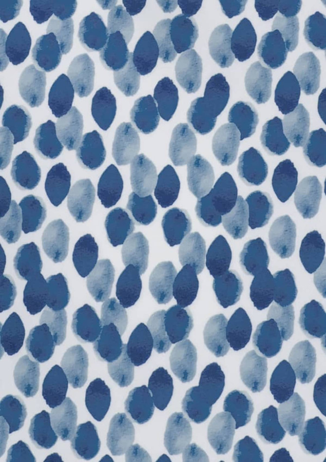 A fabric print featuring a blue and white pattern of organic, oval shapes resembling watercolour blobs.