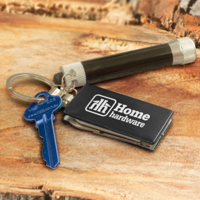 A multi-function metal key ring in silver, attached to a blue key and a small black device with a logo.