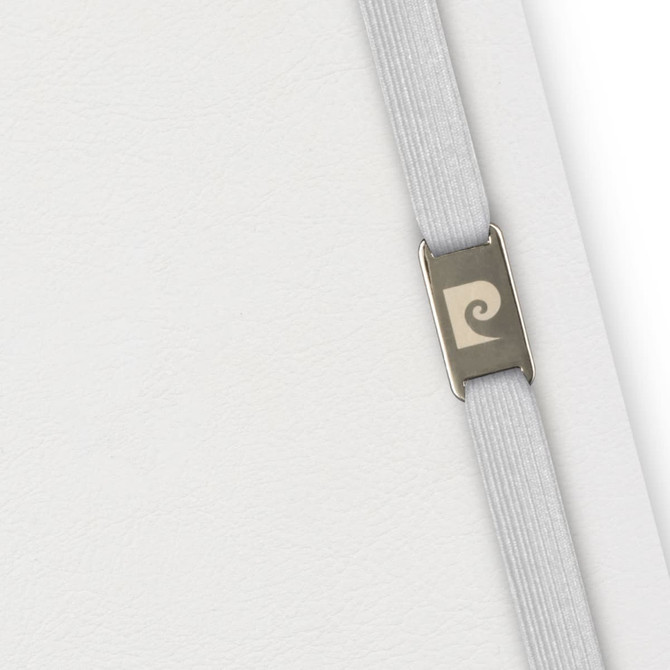 A grey notebook with a textured cover and an elastic closure featuring a branding logo.