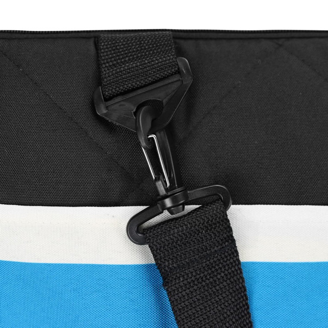 A black and blue picnic blanket with a strap and clip attachment, featuring a quilted texture.