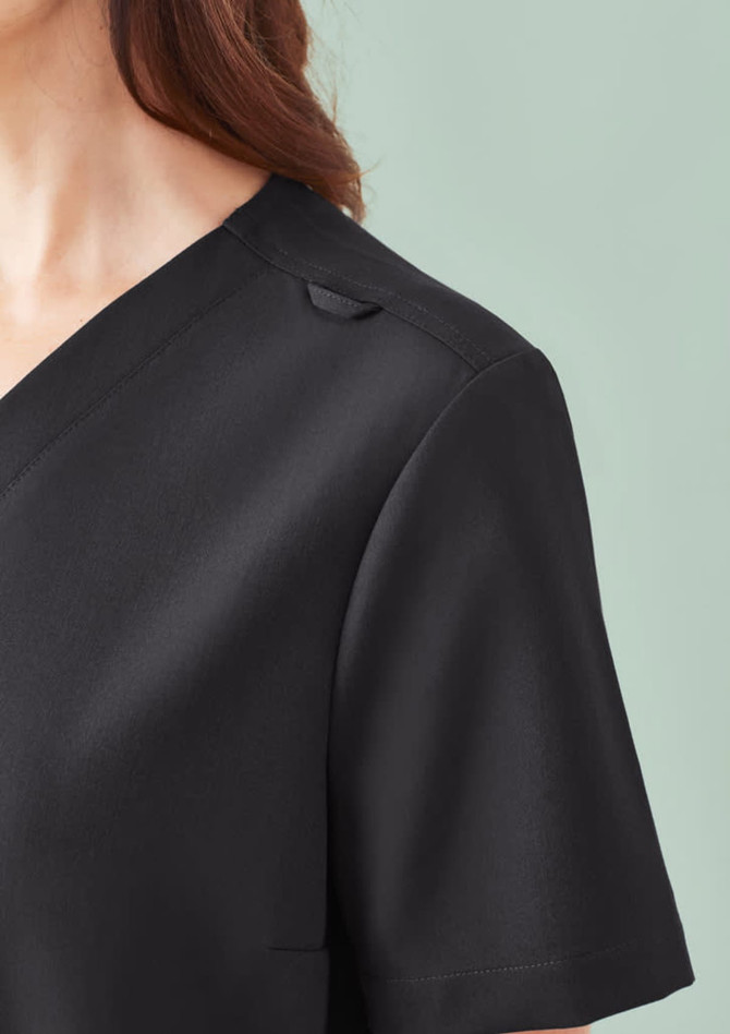 A black women's V-neck scrub top with short sleeves and a stylish design, featuring a logo on the fabric.