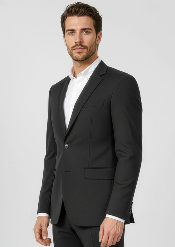 A black classic jacket for men, featuring a single button closure and a slim fit design. The model is wearing a white shirt underneath.