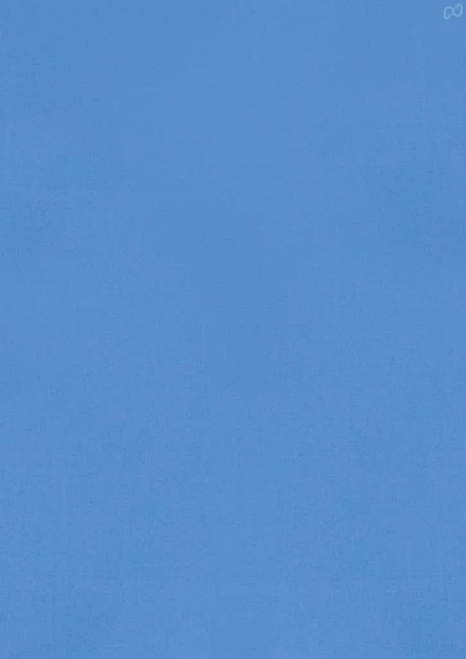 A light blue short sleeve button-up shirt with a logo.