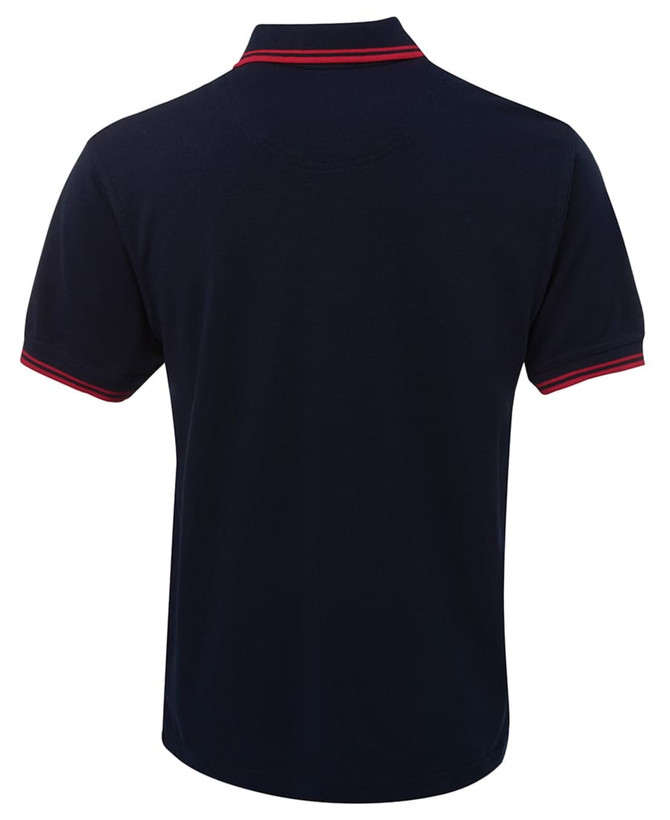 A navy polo shirt featuring contrasting red trim on the collar and sleeves, with a logo on the chest.