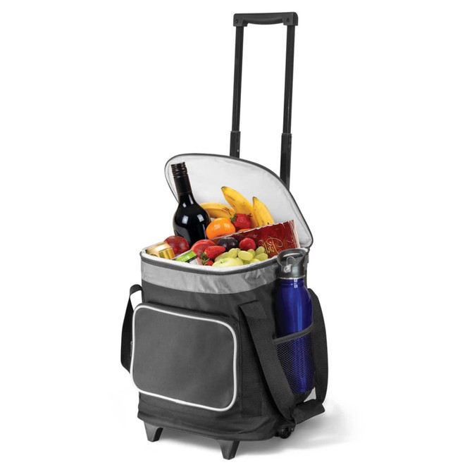 A grey cooler trolley with wheels filled with fruits, snacks, a bottle of wine, and a drink bottle. It has a front pocket.