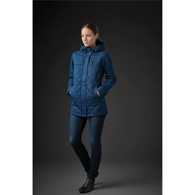A women's quilted puffer jacket in deep blue, featuring a hood and a zippered pocket, displayed on a model.