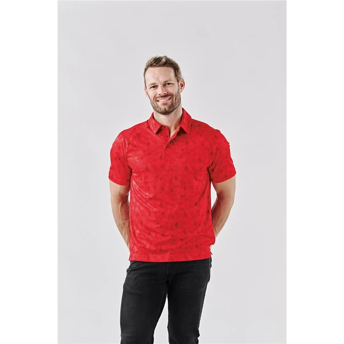 A man wearing a red polo shirt with a subtle pattern, featuring a logo on the chest and a classic collar.