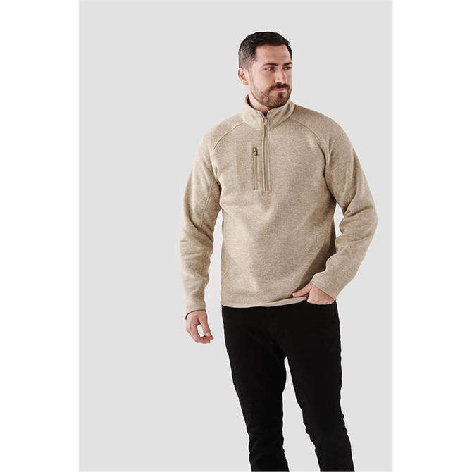 A men's cream pullover with a quarter zip and a logo, featuring a relaxed fit and raglan sleeves.