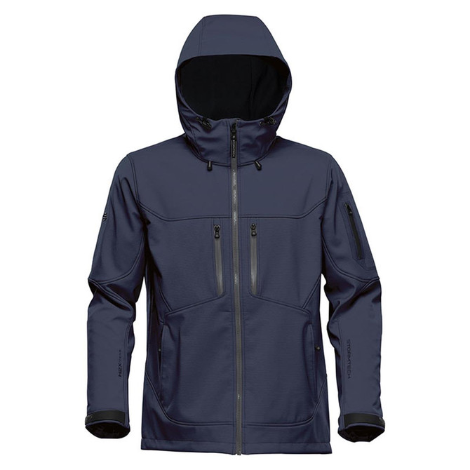 A navy blue softshell jacket with a hood and multiple zippered pockets. It features a branding logo on the side.
