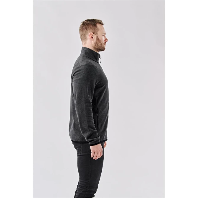 A men's full zip jacket in black, featuring a high collar and a fitted design. Has a logo on it.