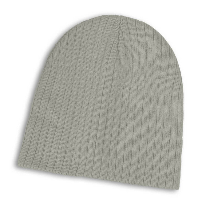 A cable knit beanie in a soft green shade, featuring a ribbed texture.