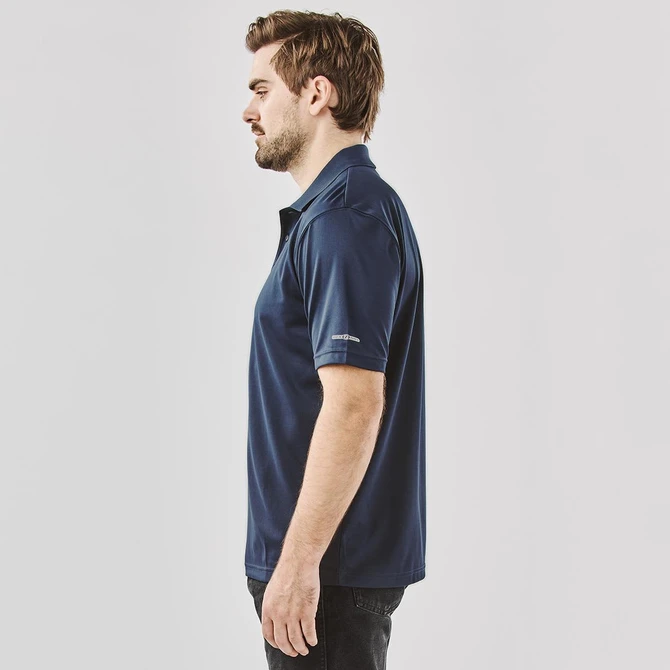 Men's polo shirt in navy blue, featuring a logo, displayed from the side. Suitable for casual or active wear.
