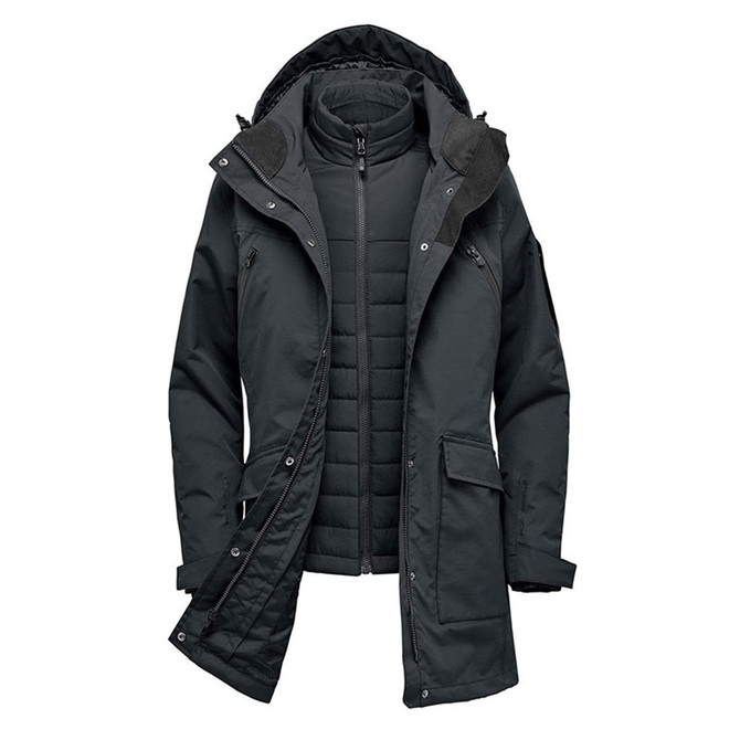 A dark green women's jacket with a removable inner layer and hood, featuring multiple pockets and a branding logo.