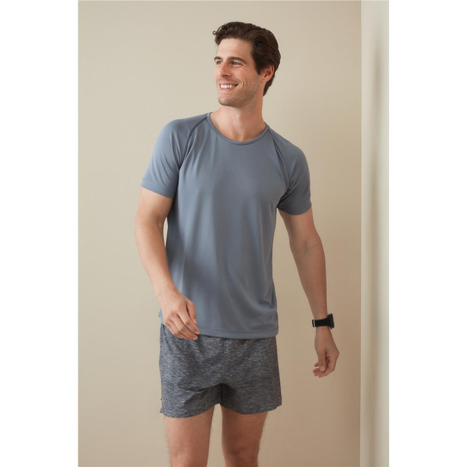A men's active team raglan t-shirt in grey, paired with dark shorts. The shirt features a crew neck and short sleeves.