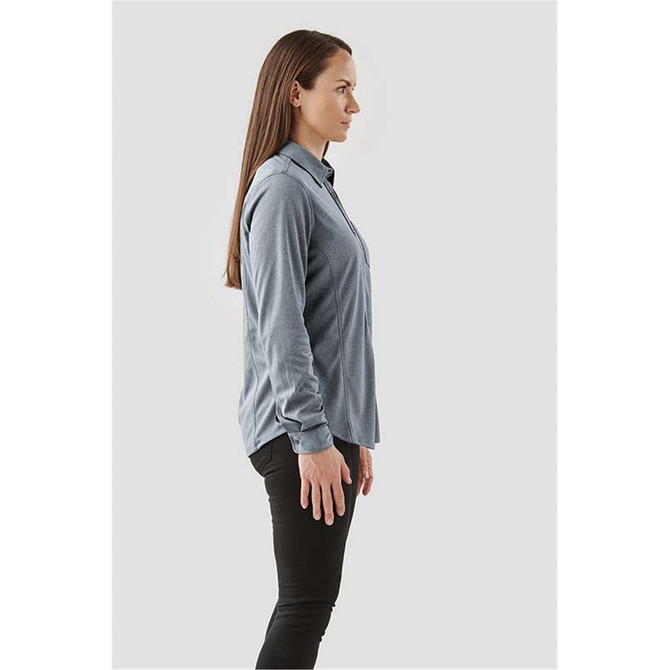 A long-sleeve button-up shirt in grey, displayed on a model from the side. The shirt features a collar and buttons.