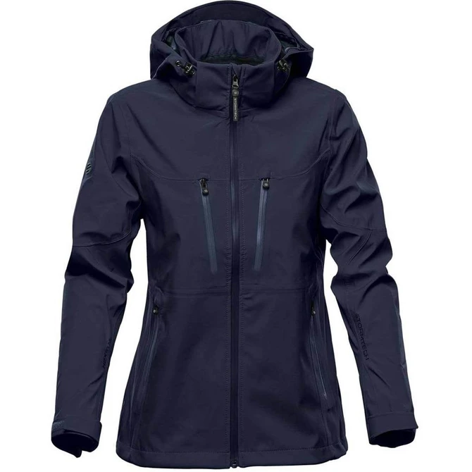 A women's softshell jacket in navy blue with a hood and multiple zippered pockets. It features a logo on the sleeve.