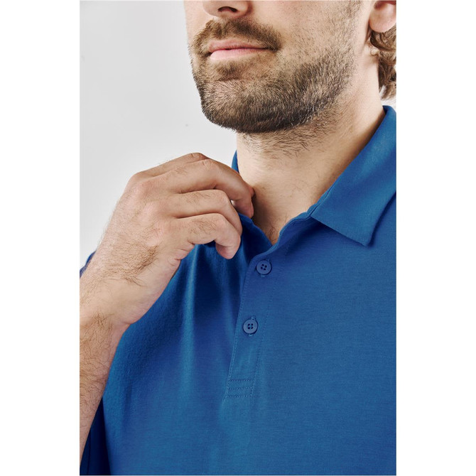 A close-up of a man adjusting a blue polo shirt with a three-button placket and a collar, featuring a logo.