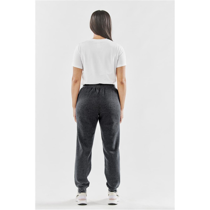 A model wearing grey women's fleece joggers from the back, paired with a white t-shirt and sneakers.