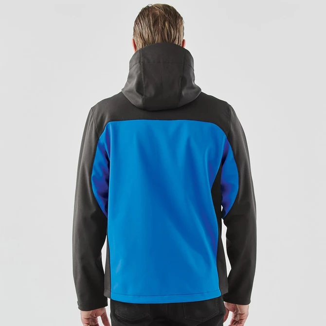 A hooded softshell jacket in blue and black, featuring a logo, viewed from the back.