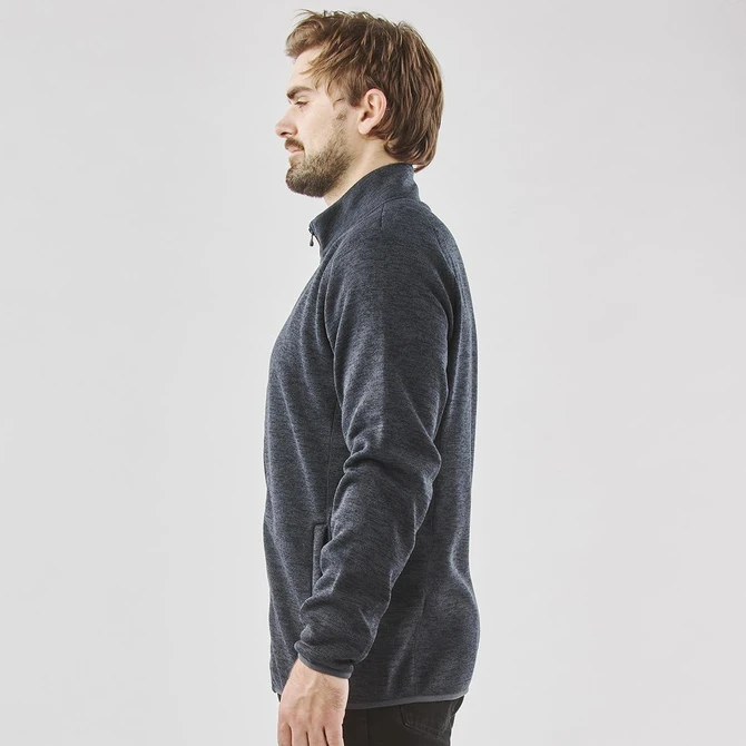 A men's full zip fleece jacket in dark navy, featuring a high collar and side pockets. It has a simple logo design.