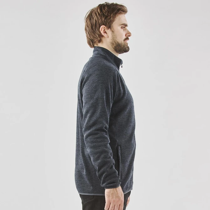 A men's fleece jacket in navy blue with a full zip and side pockets, featuring a subtle logo.