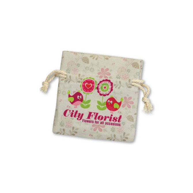 A small cotton gift bag in cream with floral designs and a drawstring closure, featuring a logo and playful bird illustrations.