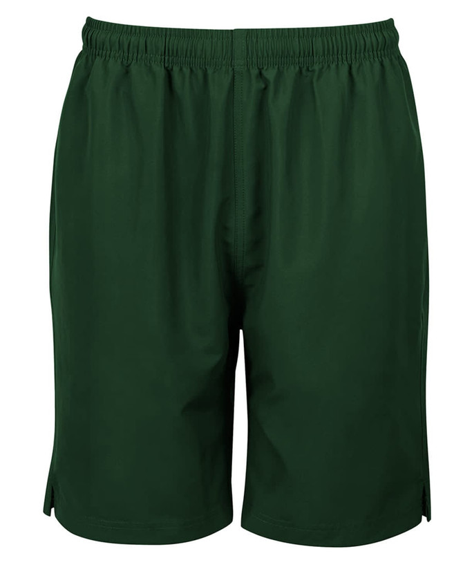 Green sports shorts with an elastic waistband and side slits, featuring a branding logo.