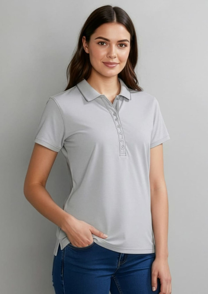 A grey women's short sleeve polo shirt with a classic collar and a button placket, featuring a logo on the chest.