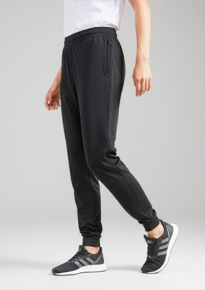 A pair of black track pants with a tapered fit, featuring convenient side pockets and an elastic waistband.