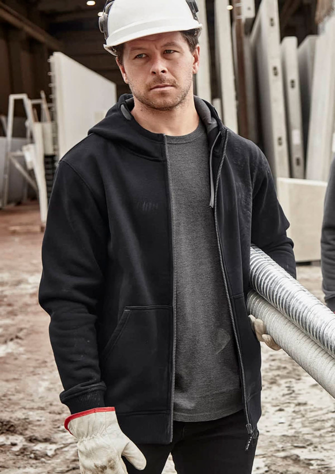 A black unisex zip front multi-pocket hoodie displayed on a person wearing gloves and a hard hat in a work environment.