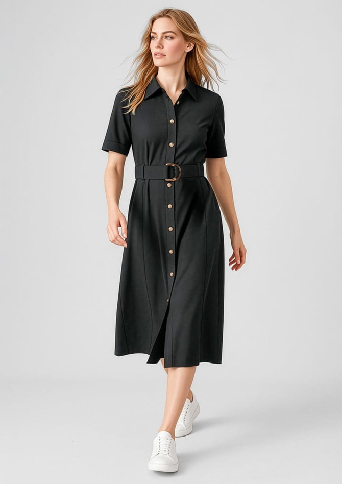 A black midi dress with a button-down front, short sleeves, and a belt, paired with white sneakers.