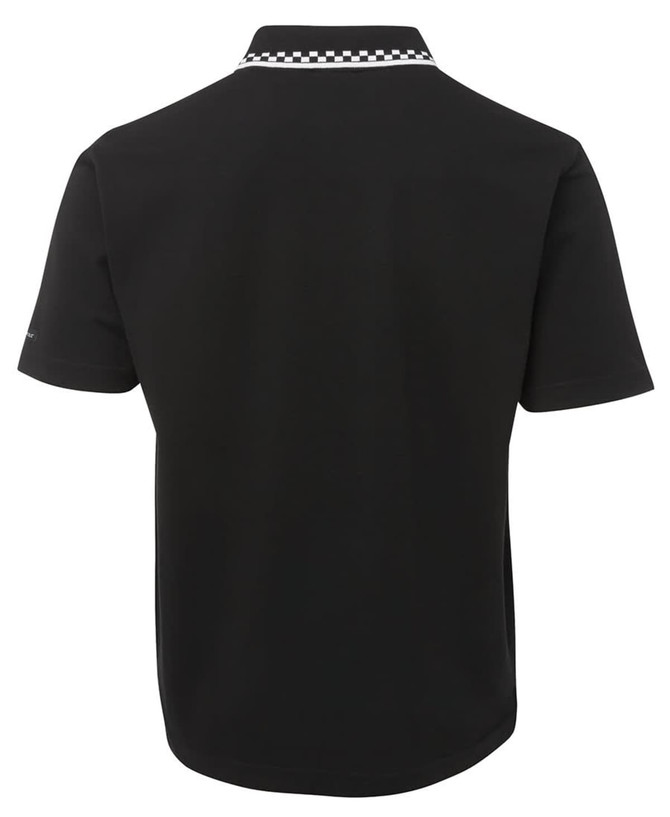 A black polo shirt featuring a white checkered collar and a branded logo on the sleeve, designed for chef wear.