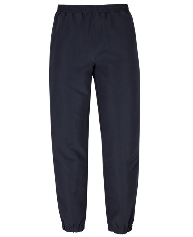 Track pants in navy blue featuring an elastic waistband and cuffed ankles. Includes a logo on the side.