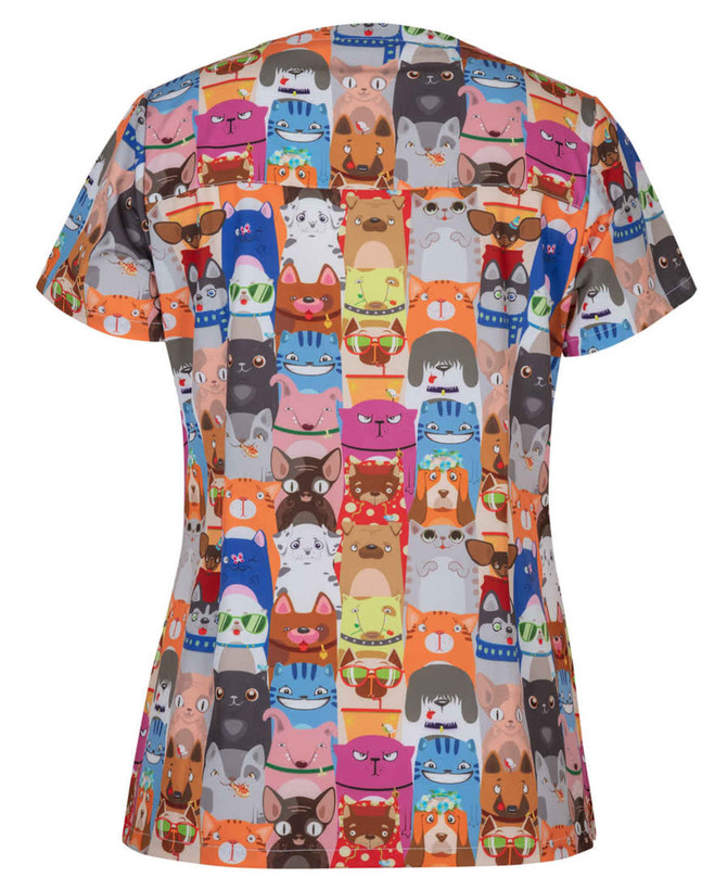 A colourful women's scrub top featuring a whimsical print of various animal faces. The design has multiple vibrant hues.