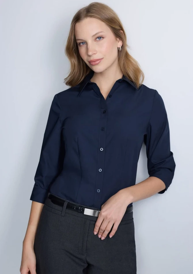 A navy blue women's 3/4 sleeve shirt, featuring a collared neckline and button front, worn by a model.