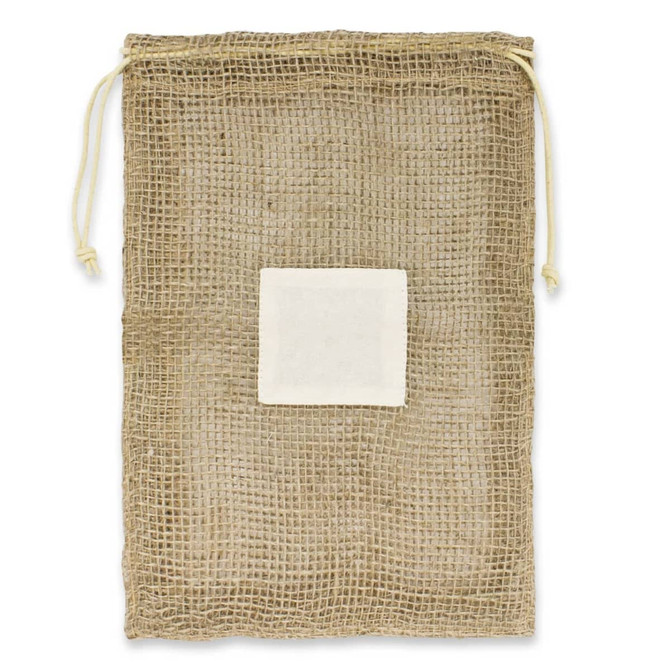 A jute net produce bag with a drawstring closure and a white label patch in the center.