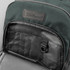 A green backpack features a textured fabric and a pocket with organisational sections and a hook. It has a logo.