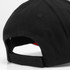 A black cap with a red interior, featuring a logo and an adjustable strap at the back.