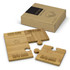 A natural bamboo coaster set featuring four interlocking puzzle pieces, presented in a cardboard box with a logo.