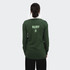 A unisex rugby jersey in green, featuring a white collar and a logo on the back.