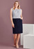 A woman wearing a light grey top and a navy straight skirt with front pleat details, posing against a neutral background.