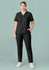A woman is wearing a black scrub top with a V-neck and matching black pants, standing against a light green background.